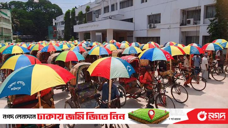Distribution of umbrellas by district administration at Dabdah in Faridpur