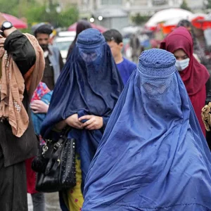 In Afghanistan, niqab is mandatory for women and beard for men